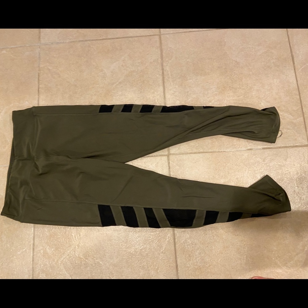 Army green leggings with black slits